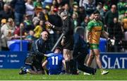1 June 2025; Referee Fergal Kelly looks on as Dara McVeety of Cavan receives medical treatment during the GAA Football All-Ireland Senior Championship Round 2 match between Cavan and Donegal at Kingspan Breffni in Cavan. Photo by Brendan Moran/Sportsfile