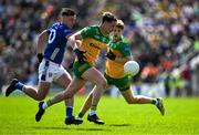 1 June 2025; Ciarán Thompson of Donegal in action against Gerard Smith of Cavan during the GAA Football All-Ireland Senior Championship Round 2 match between Cavan and Donegal at Kingspan Breffni in Cavan. Photo by Brendan Moran/Sportsfile