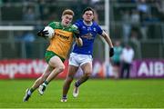 1 June 2025; Ciarán Moore of Donegal in action against Oisin Brady of Cavan during the GAA Football All-Ireland Senior Championship Round 2 match between Cavan and Donegal at Kingspan Breffni in Cavan. Photo by Brendan Moran/Sportsfile