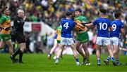 1 June 2025; Conor O'Donnell of Donegal and Cian Reilly of Cavan, 4, tussle as referee Fergal Kelly blows his whistle to intervene during the GAA Football All-Ireland Senior Championship Round 2 match between Cavan and Donegal at Kingspan Breffni in Cavan. Photo by Brendan Moran/Sportsfile