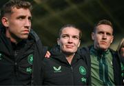 3 June 2025; Republic of Ireland's Saoirse Noonan with performance analyst Jackson Huxley, left, and STATSports analyst Ronan Molloy, right, after the UEFA Women's Nations League, League B match between Republic of Ireland and Slovenia at Páirc Uí Chaoimh in Cork. Photo by Stephen McCarthy/Sportsfile