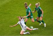 3 June 2025; Sara Makovec of Slovenia in action against Republic of Ireland players Kyra Carusa, left, and Denise O'Sullivan during the UEFA Women's Nations League, League B match between Republic of Ireland and Slovenia at Páirc Uí Chaoimh in Cork. Photo by Shauna Clinton/Sportsfile
