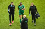 3 June 2025; Abbie Larkin of Republic of Ireland receives medical attention from physiotherapist Angela Kenneally, left, and team doctor Siobhan Forman, right, during the UEFA Women's Nations League, League B match between Republic of Ireland and Slovenia at Páirc Uí Chaoimh in Cork. Photo by Shauna Clinton/Sportsfile