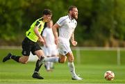 30 May 2025; Conor McGregor of Blackforge FC in action against Aaron Shortall of ROC Celtic during the AUL Challenge Cup Final match between Blackforge FC and Roc Celtic FC at the AUl Complex in Clonshaugh, Dublin. Photo by Tom Beary/Sportsfile