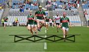 31 May 2025; David Kenny of Mayo jumps over the bench before the Nickey Rackard Cup final match between Mayo and Roscommon at Croke Park in Dublin. Photo by Stephen Marken/Sportsfile