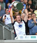 31 May 2025; James Breen of New York lifts the Lory Meagher Cup after the Lory Meagher Cup final match between Cavan and New York at Croke Park in Dublin. Photo by Stephen Marken/Sportsfile