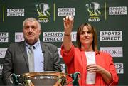 5 June 2025; Sports Direct marketing manager Sharon Lancaster draws out Galway United FC, watched by FAI President Paul Cooke, during the Sports Direct Women’s FAI Cup first round draw at the Conference Centre on the Sport Ireland National Sport Campus in Abbotstown, Dublin Photo by Seb Daly/Sportsfile