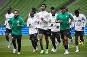 5 June 2025; Senegal players, including Abdou Diallo, centre, warm-up during a Senegal training session at the Aviva Stadium in Dublin. Photo by Ben McShane/Sportsfile