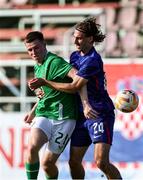 6 June 2025; Warren Davis of Republic of Ireland in action against Teo Barisic of Croatia during the U21 international friendly match between Croatia and Republic of Ireland at Gradski Stadion in Zagreb, Croatia. Photo by Gerry Scully/Sportsfile