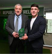 6 June 2025; Archie Quinn of Republic of Ireland is presented with the Boys' Under-15 International Player of the Year award by FAI President Paul Cooke during the 35th FAI International Awards at the Aviva Stadium in Dublin. Photo by David Fitzgerald/Sportsfile