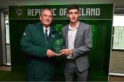 6 June 2025; Rhys Knight of Clonkeen College Blackrock, Dublin, right, is presented with the Boys' Under-18 Schools International Player of the Year award by FAI Senior Council Member Nixon Morton during the 35th FAI International Awards at the Aviva Stadium in Dublin. Photo by David Fitzgerald/Sportsfile