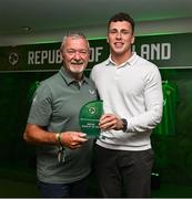 6 June 2025; Jake Dillon of Fairview Rangers, Limerick, right, is presented with the Amateur Player of the Year award by FAI Board Member David Moran during the 35th FAI International Awards at the Aviva Stadium in Dublin. Photo by David Fitzgerald/Sportsfile