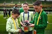 6 June 2025; Mason Geraghty, centre, reacts after getting an autograph from Republic of Ireland players before the international friendly match between Republic of Ireland and Senegal at the Aviva Stadium in Dublin. Photo by Ben McShane/Sportsfile