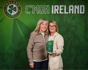 6 June 2025; Former Republic of Ireland footballer Olivia O'Toole, right, with former team-mate Linda Gorman after receiving her Hall of Fame award during the 35th FAI International Awards at the Aviva Stadium in Dublin. Photo by David Fitzgerald/Sportsfile