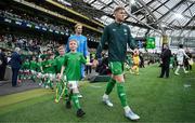6 June 2025; Republic of Ireland captain Nathan Collins leads his side out before the international friendly match between Republic of Ireland and Senegal at the Aviva Stadium in Dublin. Photo by Stephen McCarthy/Sportsfile