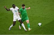 6 June 2025; Ryan Manning of Republic of Ireland in action against Antoine Mendy of Senegal during the international friendly match between Republic of Ireland and Senegal at the Aviva Stadium in Dublin. Photo by Piaras Ó Mídheach/Sportsfile
