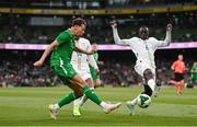 6 June 2025; Kasey McAteer of Republic of Ireland in action against Habib Diarra of Senegal during the international friendly match between Republic of Ireland and Senegal at the Aviva Stadium in Dublin. Photo by Ben McShane/Sportsfile