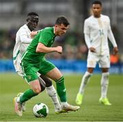6 June 2025; Jason Knight of Republic of Ireland in action against Krépin Diatta of Senegal during the international friendly match between Republic of Ireland and Senegal at the Aviva Stadium in Dublin. Photo by David Fitzgerald/Sportsfile
