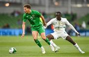 6 June 2025; Kasey McAteer of Republic of Ireland in action against Habib Diarra of Senegal during the international friendly match between Republic of Ireland and Senegal at the Aviva Stadium in Dublin. Photo by David Fitzgerald/Sportsfile