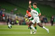 6 June 2025; Kasey McAteer of Republic of Ireland in action against Habib Diarra of Senegal during the international friendly match between Republic of Ireland and Senegal at the Aviva Stadium in Dublin. Photo by David Fitzgerald/Sportsfile