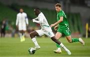 6 June 2025; Habib Diarra of Senegal in action against Kasey McAteer of Republic of Ireland during the international friendly match between Republic of Ireland and Senegal at the Aviva Stadium in Dublin. Photo by David Fitzgerald/Sportsfile