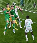 6 June 2025; Republic of Ireland players, Nathan Collins, right, and Kasey McAteer in action against Senegal goalkeeper Yehvann Diouf during the international friendly match between Republic of Ireland and Senegal at the Aviva Stadium in Dublin. Photo by Piaras Ó Mídheach/Sportsfile