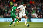 6 June 2025; Abdou Diallo of Senegal in action against Jack Taylor of Republic of Ireland during the international friendly match between Republic of Ireland and Senegal at the Aviva Stadium in Dublin. Photo by Michael P Ryan/Sportsfile