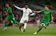 6 June 2025; Kasey McAteer of Republic of Ireland in action against Abdou Diallo of Senegal during the international friendly match between Republic of Ireland and Senegal at the Aviva Stadium in Dublin. Photo by David Fitzgerald/Sportsfile