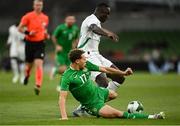 6 June 2025; Kasey McAteer of Republic of Ireland in action against Antoine Mendy of Senegal during the international friendly match between Republic of Ireland and Senegal at the Aviva Stadium in Dublin. Photo by David Fitzgerald/Sportsfile