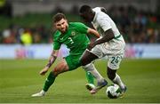 6 June 2025; Ryan Manning of Republic of Ireland in action against Antoine Mendy of Senegal during the international friendly match between Republic of Ireland and Senegal at the Aviva Stadium in Dublin. Photo by David Fitzgerald/Sportsfile