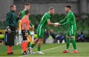 6 June 2025; Matt Doherty of Republic of Ireland, right, is substituted for Killian Phillips during the international friendly match between Republic of Ireland and Senegal at the Aviva Stadium in Dublin. Photo by Stephen McCarthy/Sportsfile