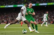 6 June 2025; Ismaïla Sarr of Senegal in action against Will Smallbone of Republic of Ireland during the international friendly match between Republic of Ireland and Senegal at the Aviva Stadium in Dublin. Photo by Ben McShane/Sportsfile