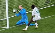 6 June 2025; Republic of Ireland goalkeeper Caoimhin Kelleher makes a save despite pressure from Ismaïla Sarr of Senegal during the international friendly match between Republic of Ireland and Senegal at the Aviva Stadium in Dublin. Photo by Piaras Ó Mídheach/Sportsfile