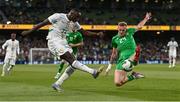 6 June 2025; Antoine Mendy of Senegal is tackled by Killian Phillips of Republic of Ireland during the international friendly match between Republic of Ireland and Senegal at the Aviva Stadium in Dublin. Photo by Ben McShane/Sportsfile