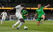 6 June 2025; Antoine Mendy of Senegal is tackled by Killian Phillips of Republic of Ireland during the international friendly match between Republic of Ireland and Senegal at the Aviva Stadium in Dublin. Photo by Ben McShane/Sportsfile