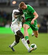 6 June 2025; Killian Phillips of Republic of Ireland in action against Antoine Mendy of Senegal during the international friendly match between Republic of Ireland and Senegal at the Aviva Stadium in Dublin. Photo by David Fitzgerald/Sportsfile