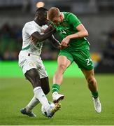 6 June 2025; Killian Phillips of Republic of Ireland in action against Antoine Mendy of Senegal during the international friendly match between Republic of Ireland and Senegal at the Aviva Stadium in Dublin. Photo by David Fitzgerald/Sportsfile