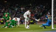 6 June 2025; Ismaïla Sarr of Senegal scores his side's first goal past Republic of Ireland goalkeeper Caoimhin Kelleher during the international friendly match between Republic of Ireland and Senegal at the Aviva Stadium in Dublin. Photo by Ben McShane/Sportsfile