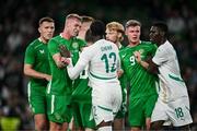 6 June 2025; Players from both teams, including Killian Phillips of Republic of Ireland and Cherif Ndiaye of Senegal, tussle during the international friendly match between Republic of Ireland and Senegal at the Aviva Stadium in Dublin. Photo by Ben McShane/Sportsfile