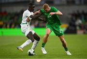 6 June 2025; Killian Phillips of Republic of Ireland in action against Antoine Mendy of Senegal during the international friendly match between Republic of Ireland and Senegal at the Aviva Stadium in Dublin. Photo by David Fitzgerald/Sportsfile