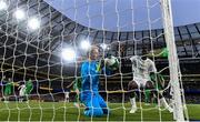 6 June 2025; Republic of Ireland goalkeeper Caoimhin Kelleher makes a goal-line save under pressure from Ismaïla Sarr of Senegal during the international friendly match between Republic of Ireland and Senegal at the Aviva Stadium in Dublin. Photo by Ben McShane/Sportsfile