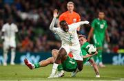 6 June 2025; Habib Diarra of Senegal in action against Killian Phillips of Republic of Ireland during the international friendly match between Republic of Ireland and Senegal at the Aviva Stadium in Dublin. Photo by Michael P Ryan/Sportsfile
