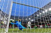 6 June 2025; Ismaïla Sarr of Senegal scores his side's first goal past Republic of Ireland goalkeeper Caoimhin Kelleher during the international friendly match between Republic of Ireland and Senegal at the Aviva Stadium in Dublin. Photo by Stephen McCarthy/Sportsfile
