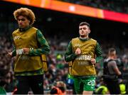 6 June 2025; Josh Honohan of Republic of Ireland, right, warms-up during the international friendly match between Republic of Ireland and Senegal at the Aviva Stadium in Dublin. Photo by Stephen McCarthy/Sportsfile
