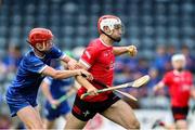 7 June 2025; Senan Lundon of Louth in action against Adam Whitney of Cavan during the Electric Ireland Celtic Challenge Corn Tom Hogan final match between Cavan and Louth at Kingspan Breffni in Cavan. Photo by Thomas Flinkow/Sportsfile
