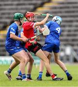 7 June 2025; Ben Marron of Louth is tackled by Cavan players, from left, Brian Mc Dermott of Cavan, Rian Crossan of Cavan, and Finan Kerr of Cavan during the Electric Ireland Celtic Challenge Corn Tom Hogan final match between Cavan and Louth at Kingspan Breffni in Cavan. Photo by Thomas Flinkow/Sportsfile
