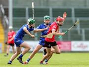 7 June 2025; Ben Marron of Louth in action against Cavan players, from left, Rian Crossan and Brian Mc Dermott during the Electric Ireland Celtic Challenge Corn Tom Hogan final match between Cavan and Louth at Kingspan Breffni in Cavan. Photo by Thomas Flinkow/Sportsfile