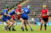 7 June 2025; Ben Marron of Louth is tackled by Cavan players, from left, Brian Mc Dermott of Cavan, Rian Crossan of Cavan, and Finan Kerr of Cavan during the Electric Ireland Celtic Challenge Corn Tom Hogan final match between Cavan and Louth at Kingspan Breffni in Cavan. Photo by Thomas Flinkow/Sportsfile
