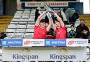 7 June 2025; Louth joint captains Luke McCourt, left, and Stephen Curtis lift the cup after the Electric Ireland Celtic Challenge Corn Tom Hogan final match between Cavan and Louth at Kingspan Breffni in Cavan. Photo by Thomas Flinkow/Sportsfile