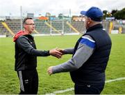 7 June 2025; Louth manager Ronan O'Gorman, left, and Cavan manager Patrick Delaney shake hands after the Electric Ireland Celtic Challenge Corn Tom Hogan final match between Cavan and Louth at Kingspan Breffni in Cavan. Photo by Thomas Flinkow/Sportsfile